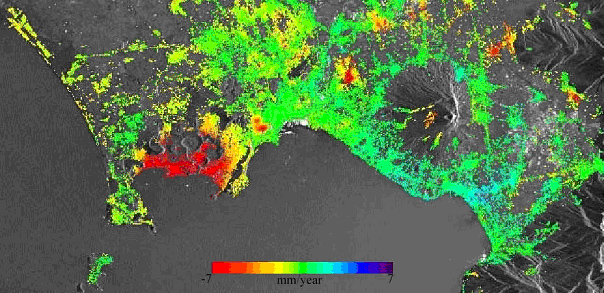 False-colour map of the measured deformation superimposed on the SAR image amplitude f Napoli Bay (Italy). The red coloured plots at the Western edge of the bay are located around the city of Pozzuoli, which is known for the ‘bradisismo’, an Italian word referring to sinking or lifting ground motion. Source: ESA. 