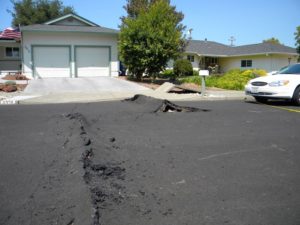 Fault damage in the suburbs West of Napa: The fault rupture ran through homes and across roads.