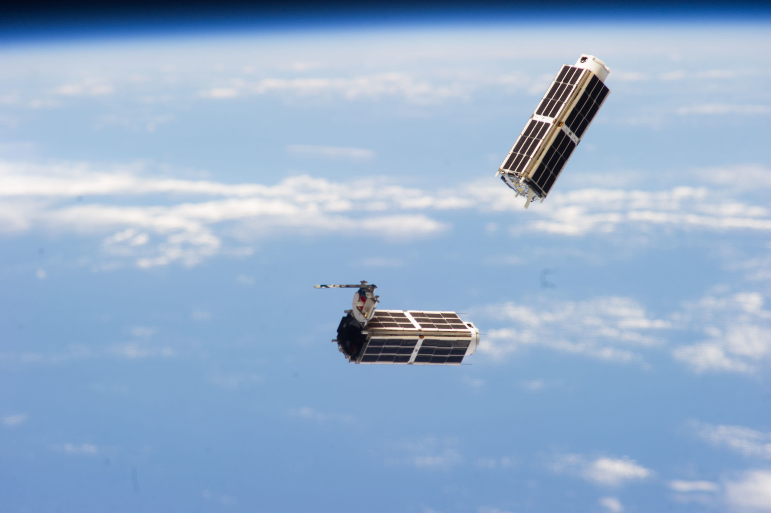 “Shortly after release, two doves float against the Earth’s horizon, still in view of the International Space Station. After deployment, the satellites go through what is called a commissioning period. Each Dove is powered on, and tests are run to confirm that all systems are functional.” Source: Planet Labs