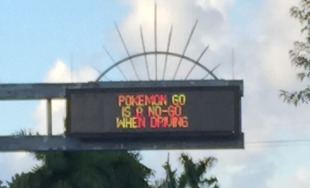 Hunting Pokémon on the go! Traffic Board in Florida warns users to take care! Photo by: Cyclonebiskit, CC-BY-SA 4.0